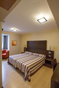 Postel nebo postele na pokoji v ubytování Hotel Juleca