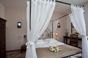 Postel nebo postele na pokoji v ubytování Hotel Tacl