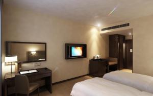 Ένα ή περισσότερα κρεβάτια σε δωμάτιο στο Lintas View Hotel