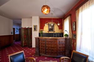 a room with a counter and a mirror at Hotel Tacl in Holešov