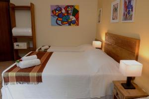 Cama ou camas em um quarto em Pousada Moryba