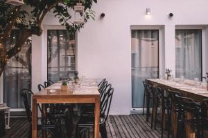 a row of tables and chairs in a restaurant at Santa Bica Eat Drink & Sleep in Lisbon