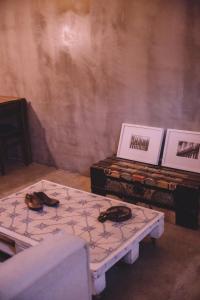 a room with two tables with shoes on them at Santa Bica Eat Drink & Sleep in Lisbon