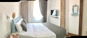 Postel nebo postele na pokoji v ubytování Ayshe Hotel