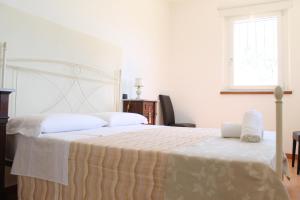 Кровать или кровати в номере Il casale di famiglia