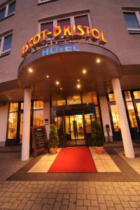 a building with a red carpet in front of a hotel at Hotel Ascot Bristol in Potsdam