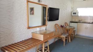 Kuchyň nebo kuchyňský kout v ubytování Coachman Motel