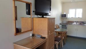 Kuchyň nebo kuchyňský kout v ubytování Coachman Motel