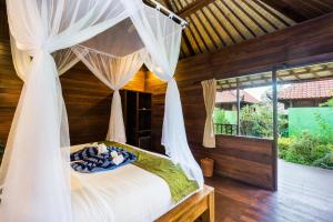 Voodi või voodid majutusasutuse Laguna Reef Huts toas