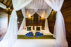 Voodi või voodid majutusasutuse Laguna Reef Huts toas