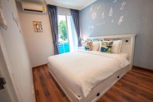 Postel nebo postele na pokoji v ubytování My Resort Condo Hua Hin F202 + 36 fotografií