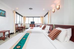 Postel nebo postele na pokoji v ubytování Angkor Udom Guesthouse