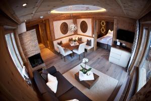 an overhead view of a living room and dining room at Stock Apartments in Mayrhofen +6 photos