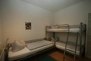 a bedroom with two bunk beds in a room at Ferienwohnung Templin in Templin