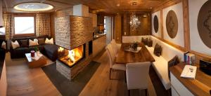 an overhead view of a living room with a fireplace at Stock Apartments in Mayrhofen