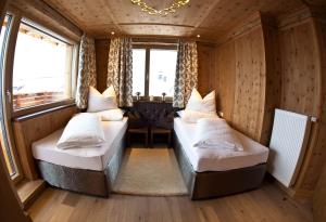 a room with two beds in a train at Stock Apartments in Mayrhofen