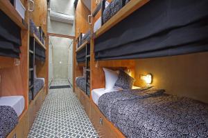 a bedroom with a bed in a room at Sunshine Vintage House in Ubud