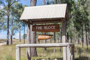 a sign that says the block on a tree at The Block Vista B&B in Nanango