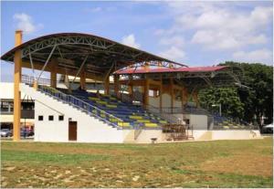 a baseball stadium with blue seats in the stands at Farzai Homestay in Lumut