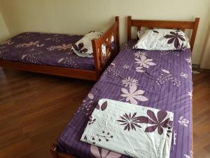 En eller flere senge i et værelse på Guest House Sadovo