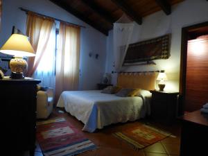 Säng eller sängar i ett rum på Villa Amalia - mansarda