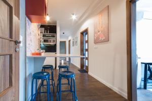 Kuchyň nebo kuchyňský kout v ubytování Quattro Loft Hostel