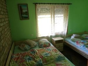 Ένα ή περισσότερα κρεβάτια σε δωμάτιο στο Guest House Vējaines