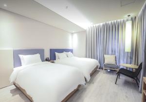 Postel nebo postele na pokoji v ubytování Londoner Hotel Gwangan + 37 fotografií