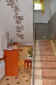 a lobby with a staircase in a building at Agroturystyka Krysia Pilszcz in Pilszcz