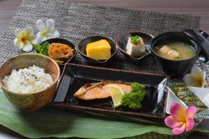 a plate of food with sushi and rice on a table at Hotel Sulata Ashikaga (Adult Only) in Ashikaga