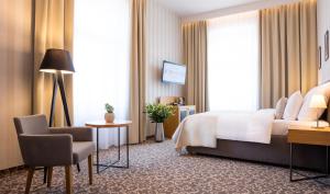 Posteľ alebo postele v izbe v ubytovaní Hotel Schwaiger