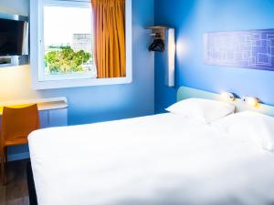 Postel nebo postele na pokoji v ubytování ibis budget Copiapo