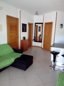 a bedroom with a bed and a desk in it at Vilas Horizonte in Porto Santo
