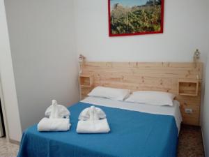 Postel nebo postele na pokoji v ubytování Casa della Nonna Polignano a mare