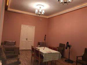 a dining room with a table and chairs at Beaming_House in Sheki +86 photos