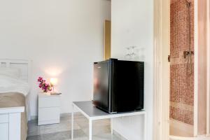 TV a/nebo společenská místnost v ubytování Hostal Alegre