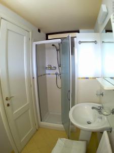 a bathroom with a shower and a sink at Bed And Breakfast Perla Del Sole in Arenella