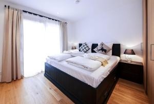 Ein Bett oder Betten in einem Zimmer der Unterkunft Steinberghaus Apartments