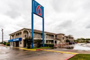 a hotel with a sign in front of a parking lot at Motel 6 San Antonio, TX - Frost Bank Center in San Antonio