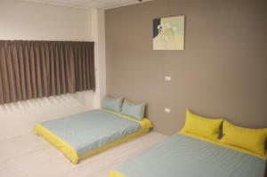 Letto o letti in una camera di 菜爺爺親子蔬宿Vegepapa B&B