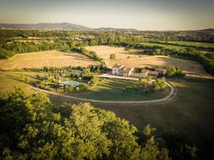 an aerial view of a large house in a field at Relais Santa Margherita in Capolona