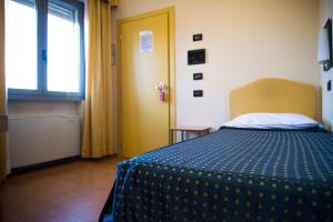 Posteľ alebo postele v izbe v ubytovaní Hotel Masini