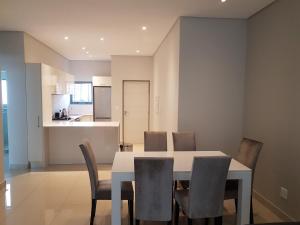 a dining room with a table and chairs at Daisy Place in Johannesburg