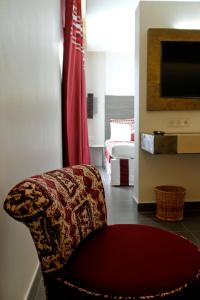 TV a/nebo společenská místnost v ubytování ONOMO Hotel Lomé