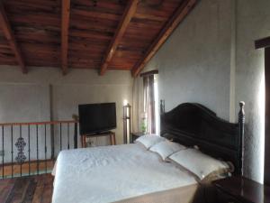 Cama o camas de una habitación en Rancho los Madroños