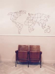 ボローニャにあるSiparioの壁面世界地図図