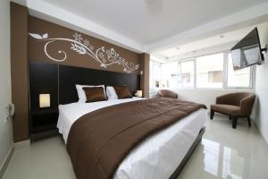 En eller flere senge i et værelse på Hotel Solec