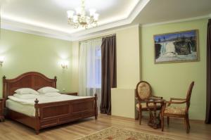 Кровать или кровати в номере Бутик-Отель Столица
