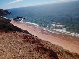 an aerial view of a beach next to the ocean at Vivenda Familia Pedro in Vila do Bispo