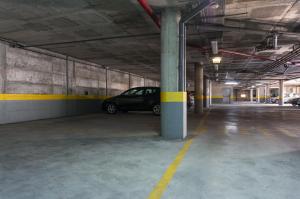 a parking garage with a car parked in it at Beach House Ericeira in Ericeira